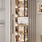 Glass corner display and wine storage cabinet beside a modern TV unit
