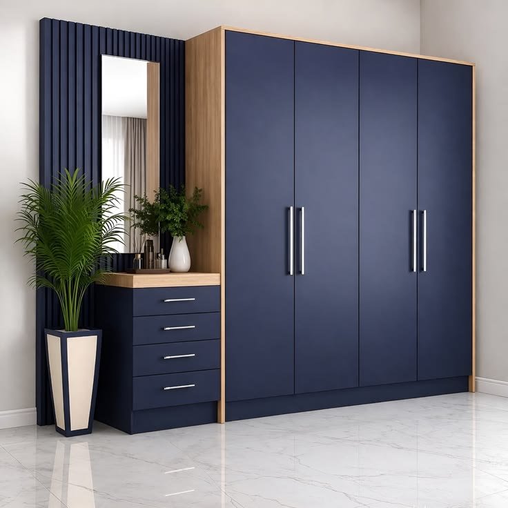 Navy blue fitted wardrobe with matching dressing table and mirror, built by Rusar Best Furniture in Accra