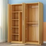 Light oak wardrobe interior showing shelving, a centre divider and hanging rails